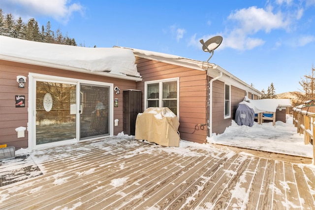 view of snow covered deck