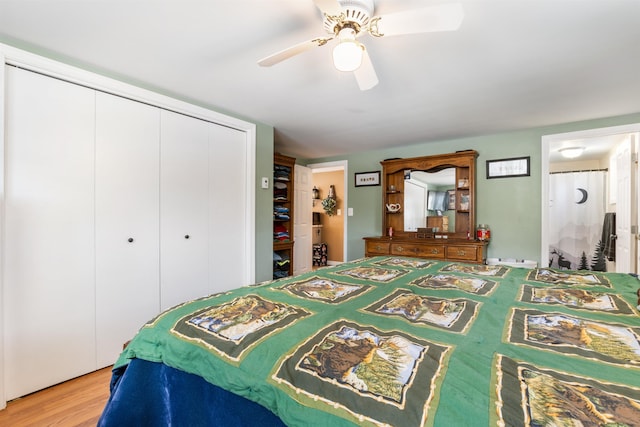 bedroom with wood-type flooring, a closet, and ceiling fan