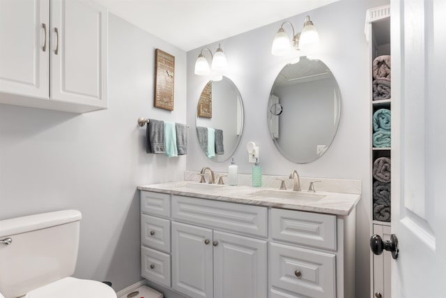 bathroom featuring vanity and toilet