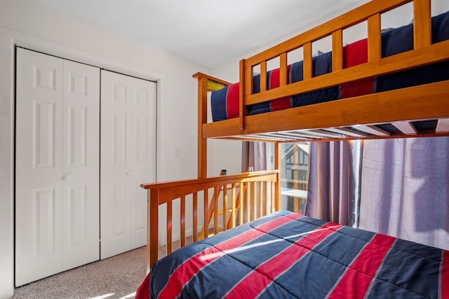 bedroom featuring carpet flooring and a closet