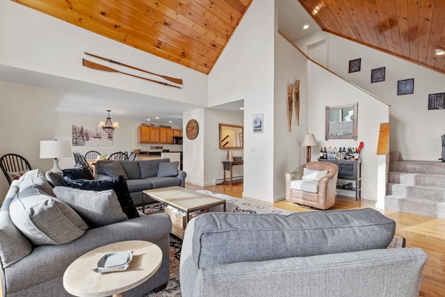 living room featuring a baseboard radiator, high vaulted ceiling, wood ceiling, and light hardwood / wood-style flooring