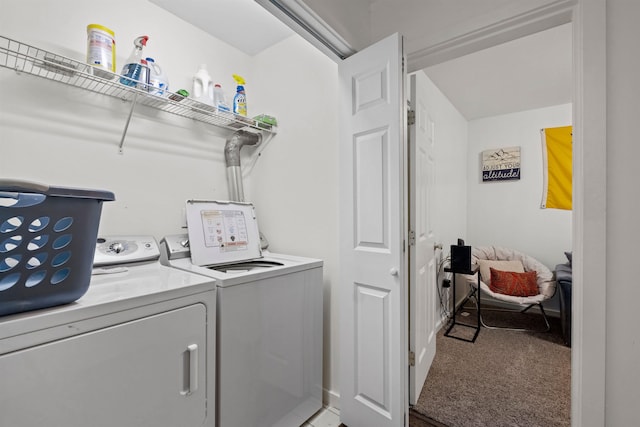 laundry room featuring washing machine and clothes dryer and carpet