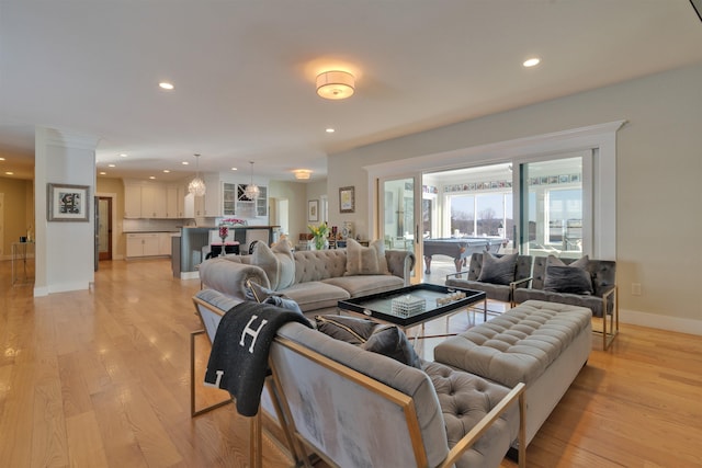 living room with light hardwood / wood-style flooring