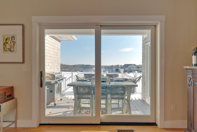 doorway to outside featuring light hardwood / wood-style floors