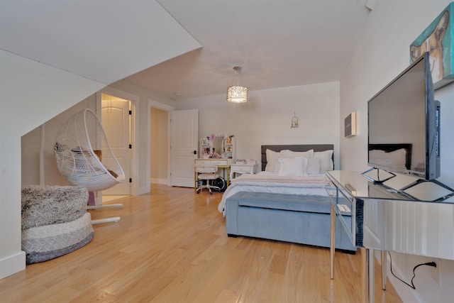 bedroom with hardwood / wood-style floors