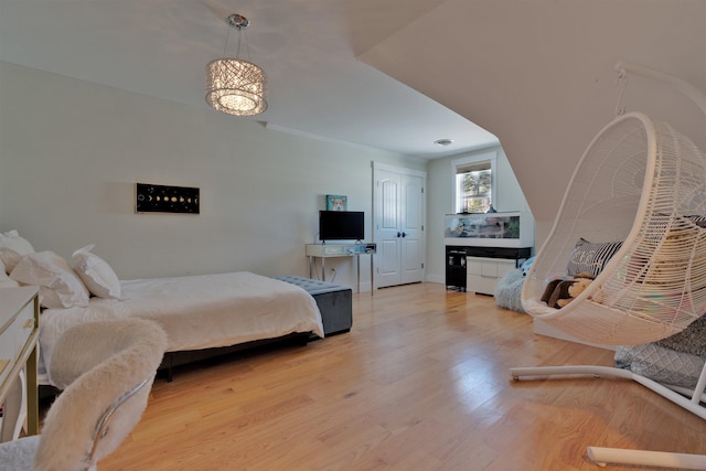 bedroom with light hardwood / wood-style flooring