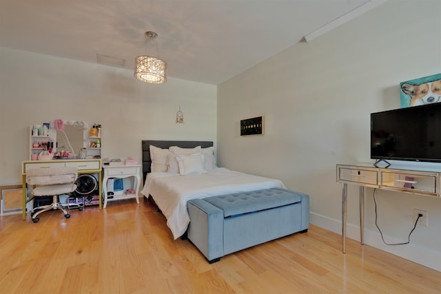 bedroom with hardwood / wood-style flooring