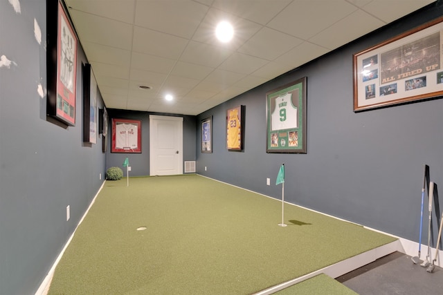 interior space featuring a paneled ceiling and carpet floors