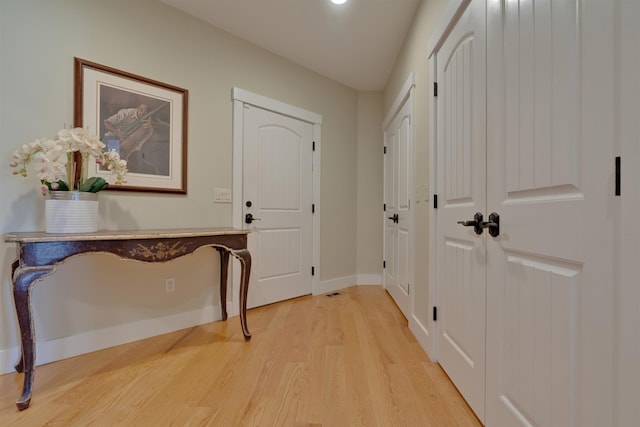 entryway with light hardwood / wood-style flooring