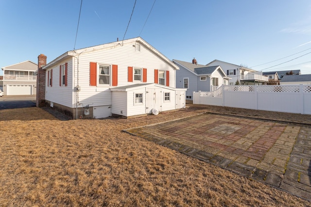 back of house with a patio area