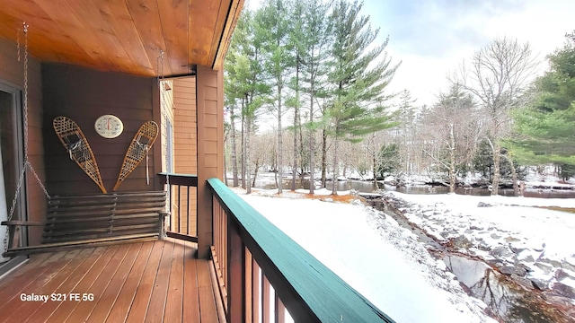 view of snow covered deck