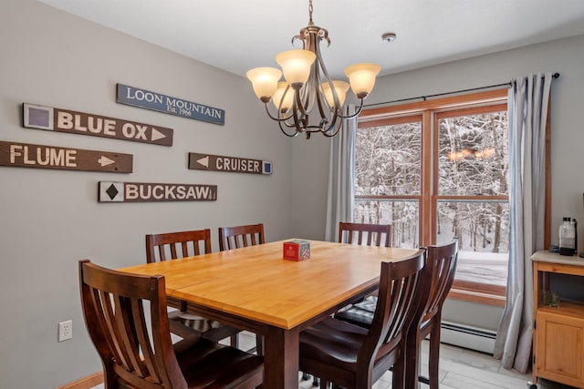 dining space featuring a notable chandelier and baseboard heating