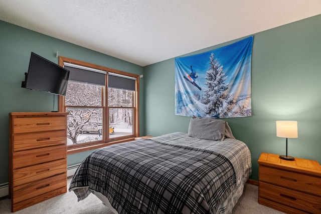 carpeted bedroom with a baseboard radiator