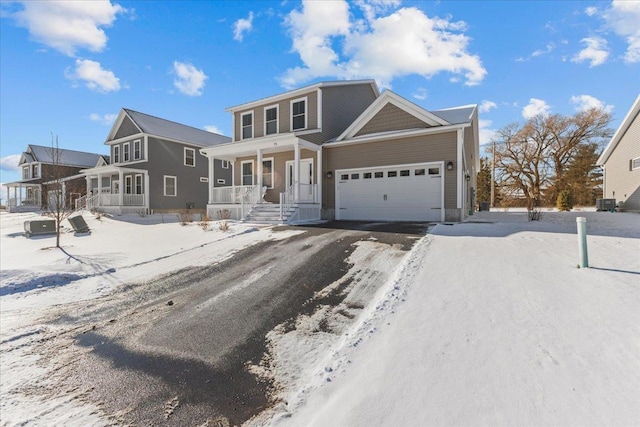 view of front of property with a porch and a garage