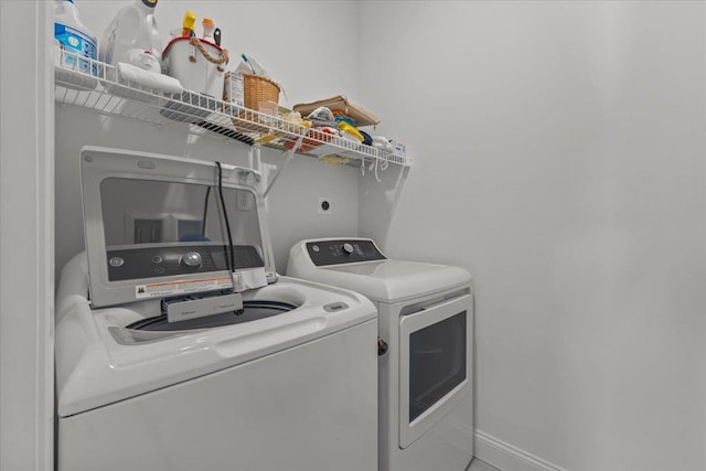 laundry room featuring washer and clothes dryer