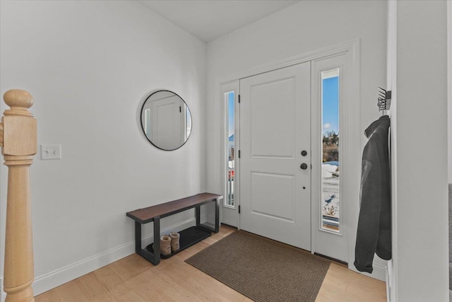 entrance foyer featuring a wealth of natural light and light hardwood / wood-style flooring