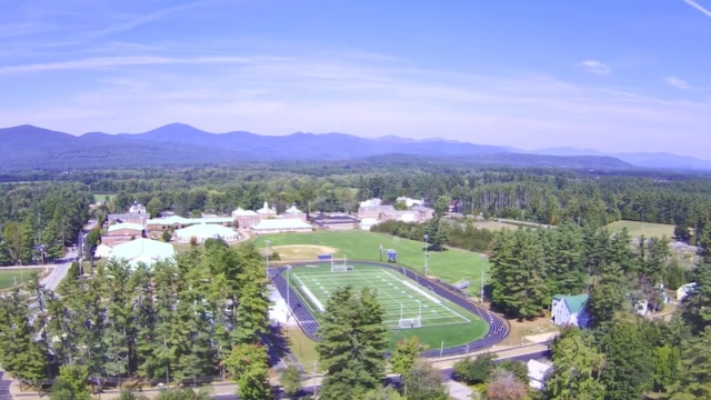 birds eye view of property featuring a mountain view