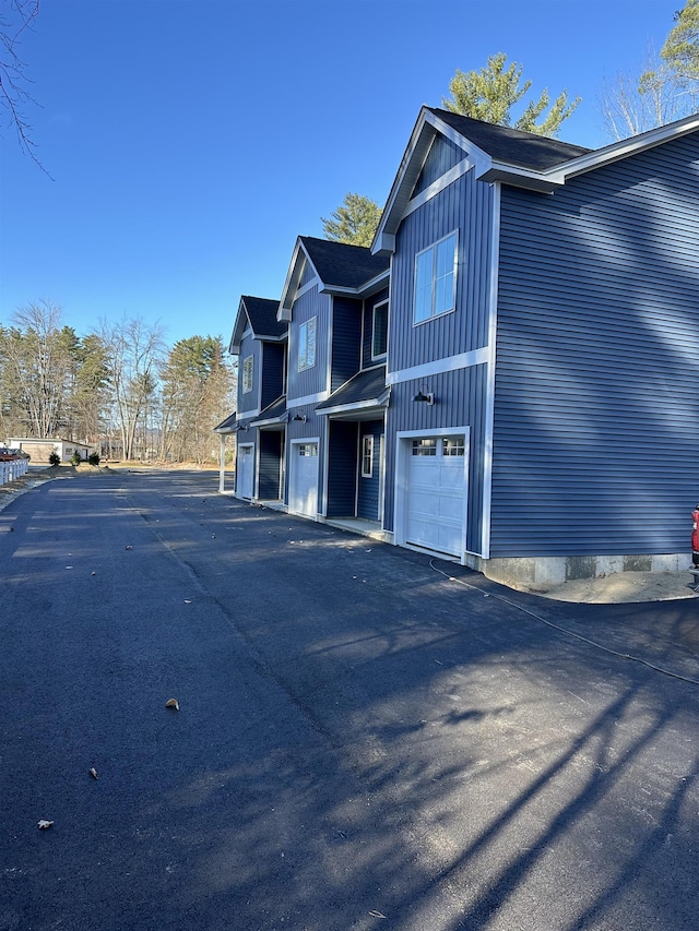 view of property exterior with a garage