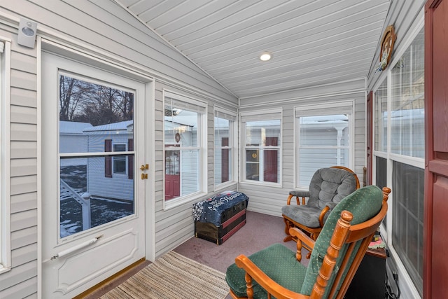 sunroom featuring vaulted ceiling