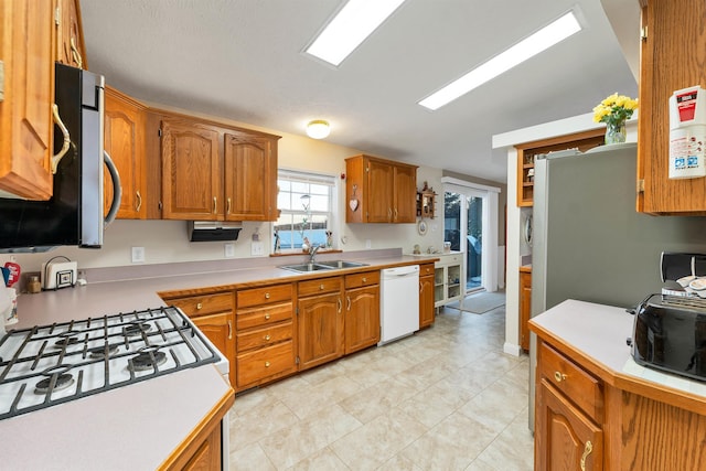 kitchen featuring sink and white appliances