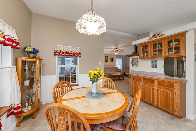 dining room featuring a wealth of natural light, ceiling fan, and light tile patterned floors