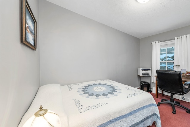 carpeted bedroom with a textured ceiling