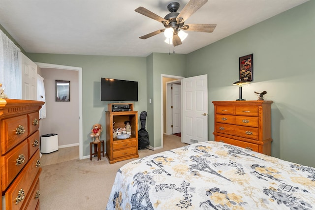 carpeted bedroom with lofted ceiling and ceiling fan