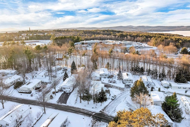 snowy aerial view with a mountain view