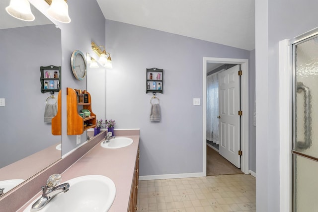 bathroom featuring vanity and a shower with door