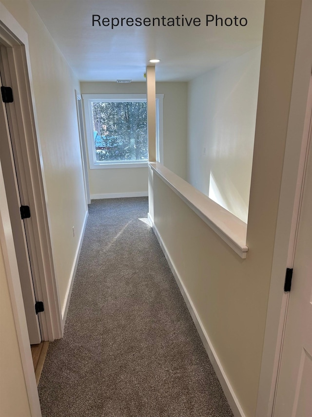 hallway with carpet