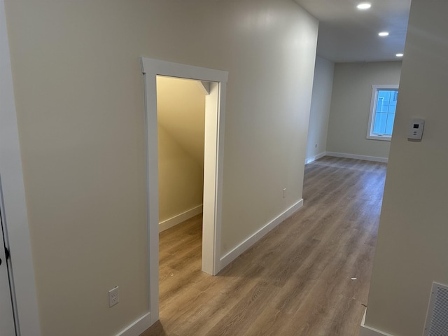 hall with light hardwood / wood-style flooring