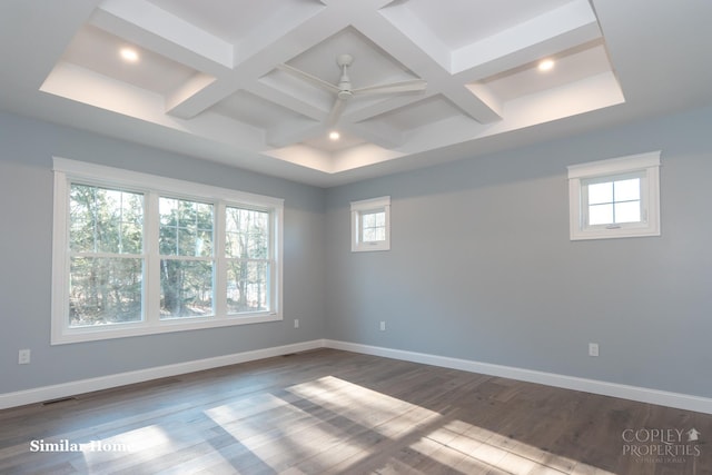 unfurnished room with ceiling fan, coffered ceiling, hardwood / wood-style floors, and beam ceiling