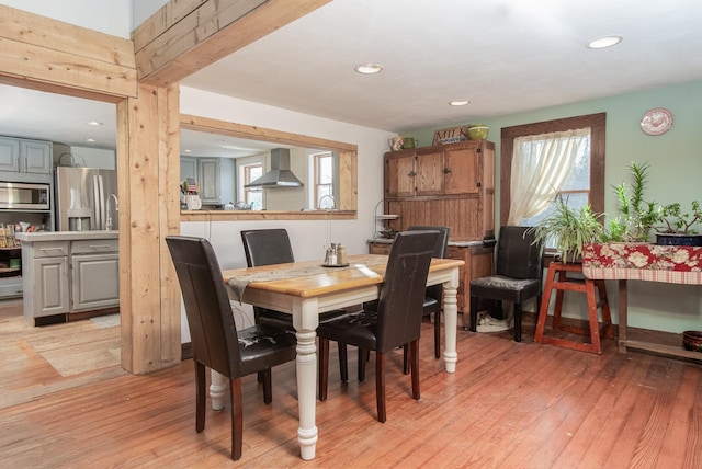 dining space with light wood-type flooring