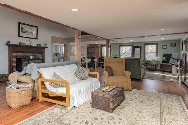 living room featuring a fireplace and hardwood / wood-style floors