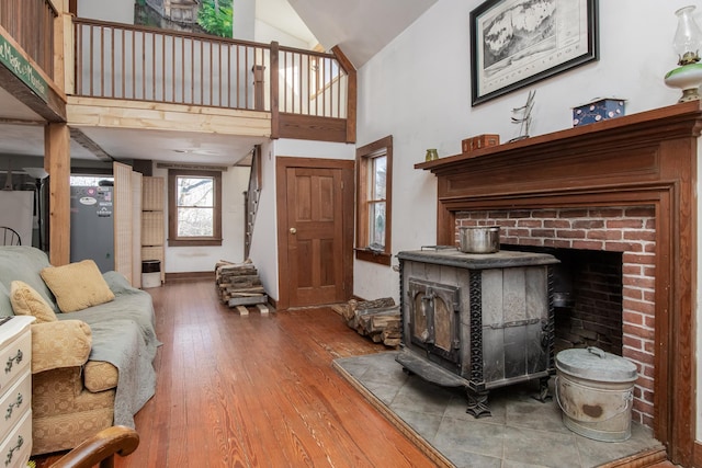 living room featuring hardwood / wood-style floors and high vaulted ceiling