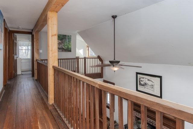 hall featuring lofted ceiling and dark hardwood / wood-style flooring