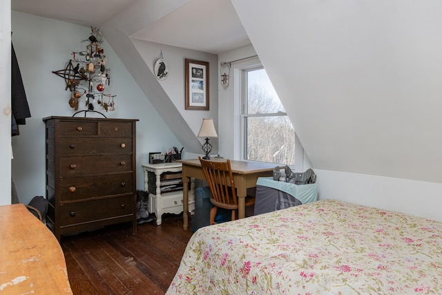 bedroom with lofted ceiling and dark wood-type flooring