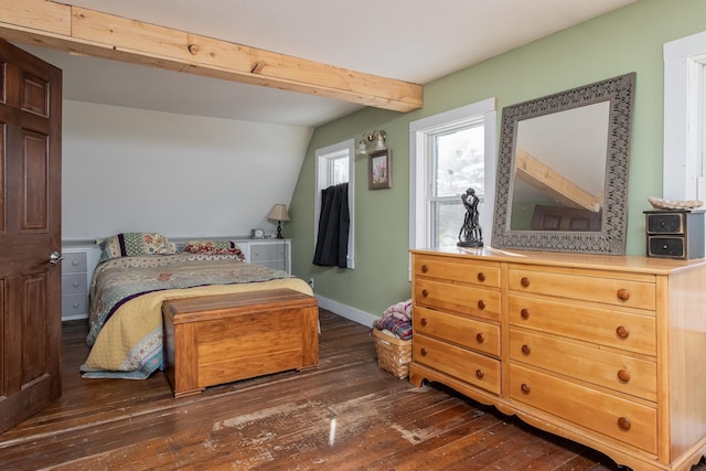 bedroom with lofted ceiling with beams and dark wood-type flooring