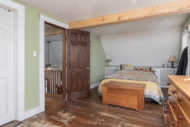 bedroom featuring dark wood-type flooring and beam ceiling