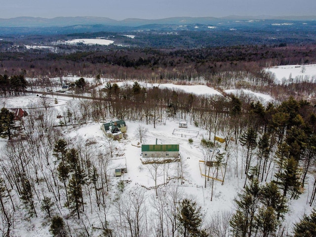 snowy aerial view with a mountain view