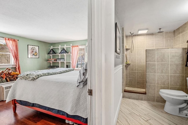 bedroom featuring hardwood / wood-style flooring