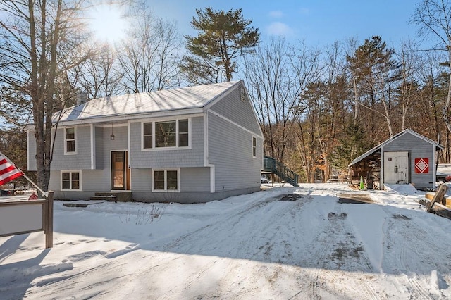 raised ranch with a storage shed