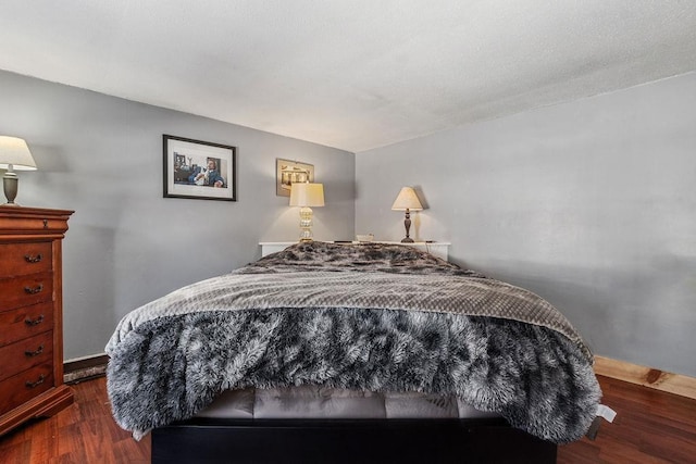 bedroom featuring dark wood-type flooring