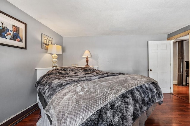 bedroom featuring dark wood-type flooring