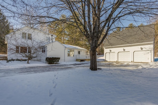 yard covered in snow with a garage