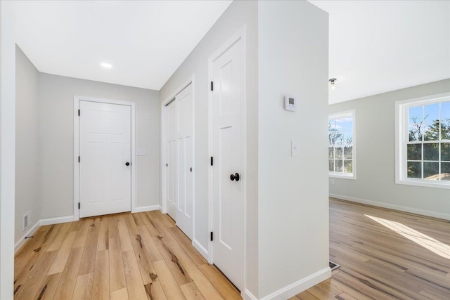 corridor featuring light hardwood / wood-style floors