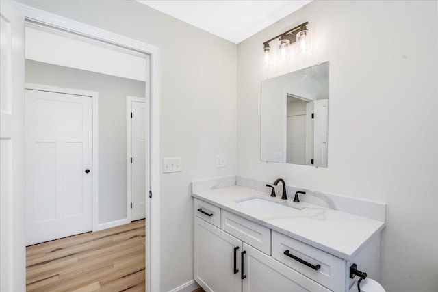 bathroom with vanity and hardwood / wood-style flooring