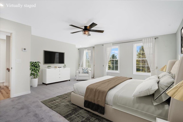 carpeted bedroom with ceiling fan