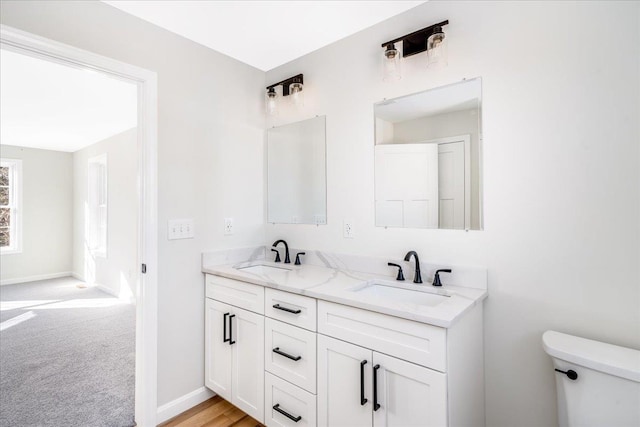 bathroom with vanity and toilet