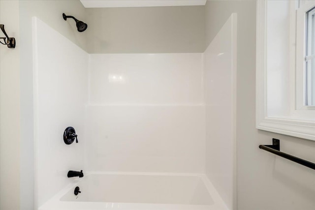 bathroom featuring washtub / shower combination